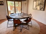 The dining area offers comfortable seating for 6 guests.